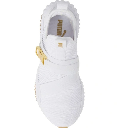 Shop Puma Defy Mid Varsity Sneaker In  White/ Metallic Gold