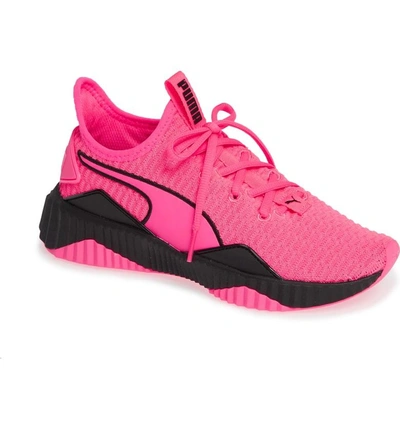 Shop Puma Defy Sneaker In Knockout Pink/  Black