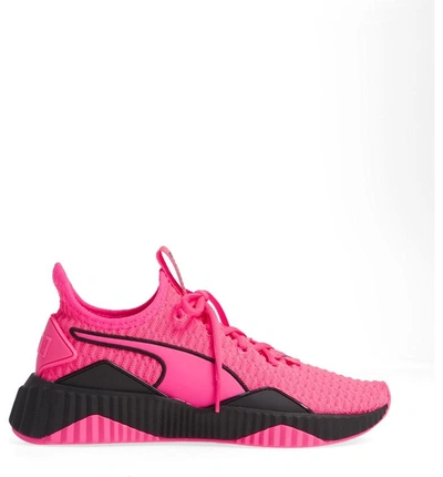 Shop Puma Defy Sneaker In Knockout Pink/  Black
