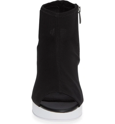 Shop Donna Karan Rivera Mid-wedge Sandal In Black Stretch Fly Knit