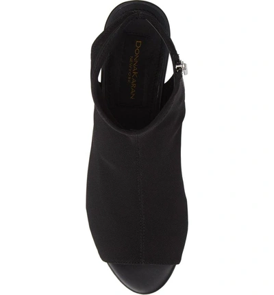 Shop Donna Karan Rivera Mid-wedge Sandal In Black Stretch Fly Knit