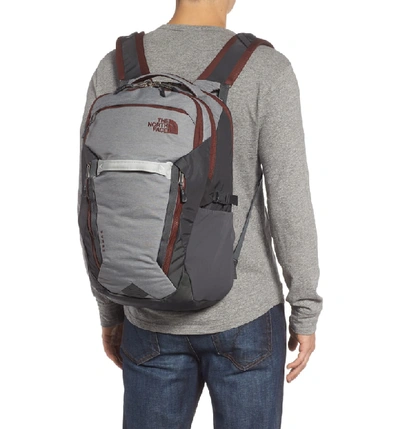 Shop The North Face Surge Backpack - Grey In Zinc Grey Heather/ Sequoia Red