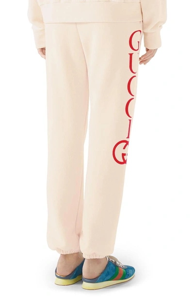 Shop Gucci Logo Cotton Sweatpants In Natural/ Live Red
