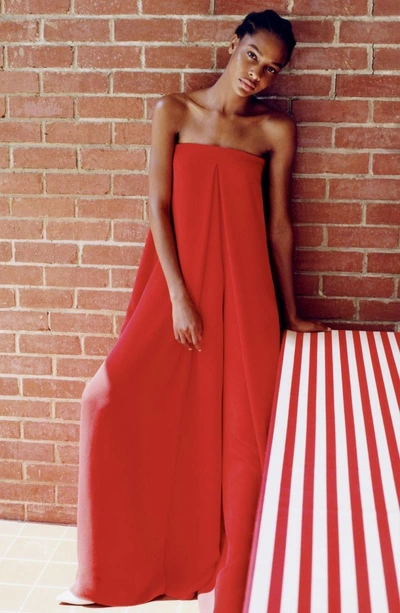 Shop Valentino Pleated Strapless Jumpsuit In Red