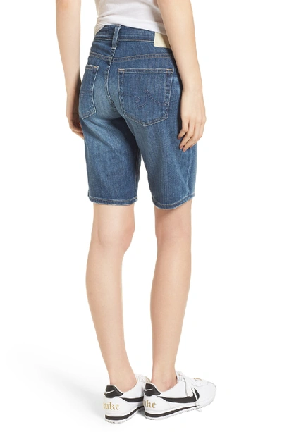 Shop Ag 'nikki' Distressed Denim Bermuda Shorts In 11 Years Sapphire Sky