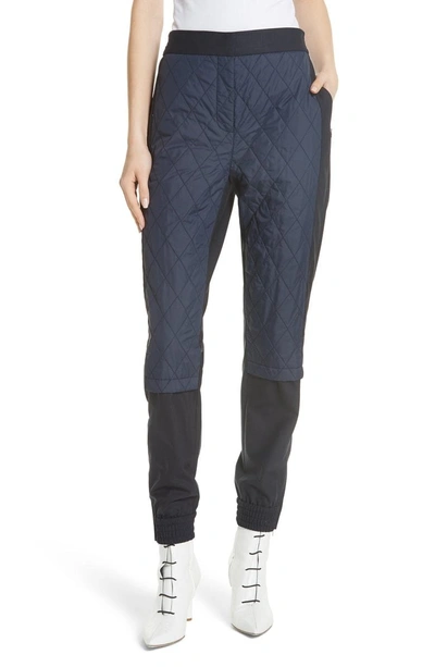 Shop Tibi Mix Media Quilted Jogger Pants In Navy