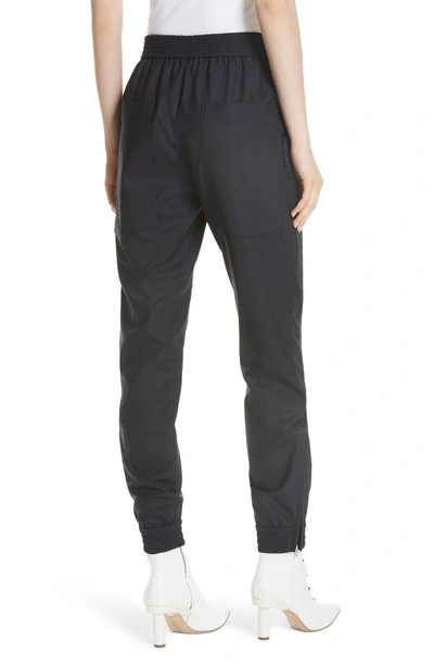 Shop Tibi Mix Media Quilted Jogger Pants In Navy