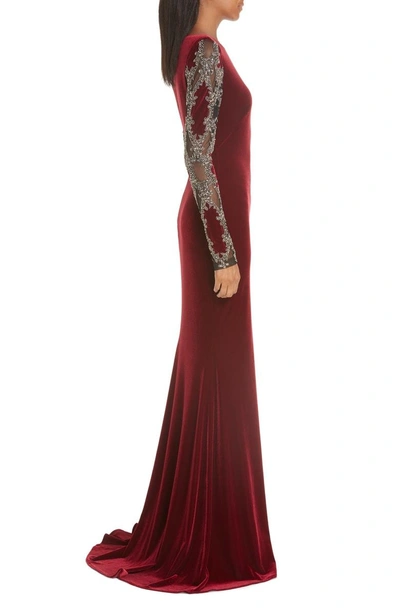 Shop Badgley Mischka Embellished Sleeve Velvet Gown In Ruby