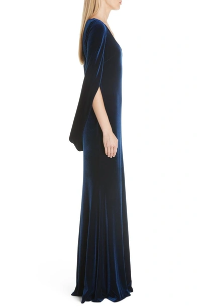 Shop Badgley Mischka Velvet Drape Sleeve Gown In Sapphire