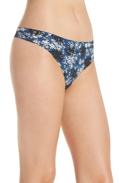 Shop Calvin Klein Invisibles Thong In Simple Floral/ Lyria Blue