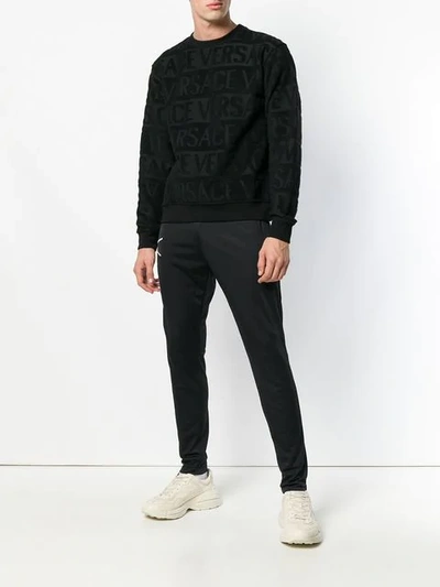Shop Versace Printed Logo Sweatshirt In Black