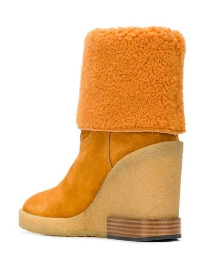 Shop Tod's Foldover Shearling Boots - Orange