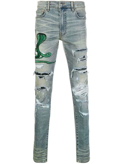 Shop Amiri Snake Patch Distressed Jeans - Blue