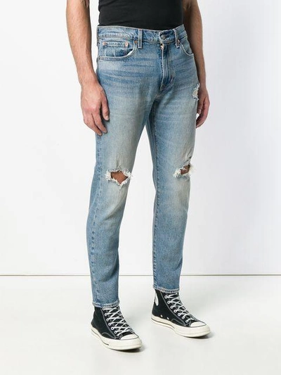 Shop Levi's Distressed Straight Leg Jeans In Blue