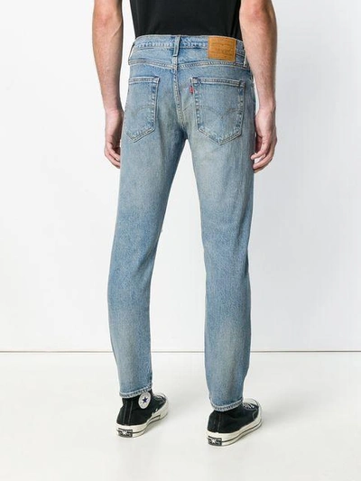 Shop Levi's Distressed Straight Leg Jeans In Blue