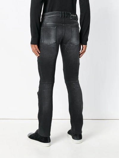 Shop Balmain Distressed Skinny Jeans In 176 Noir