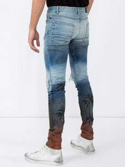 Shop Amiri Palm Thrasher Distressed Skinny Jeans