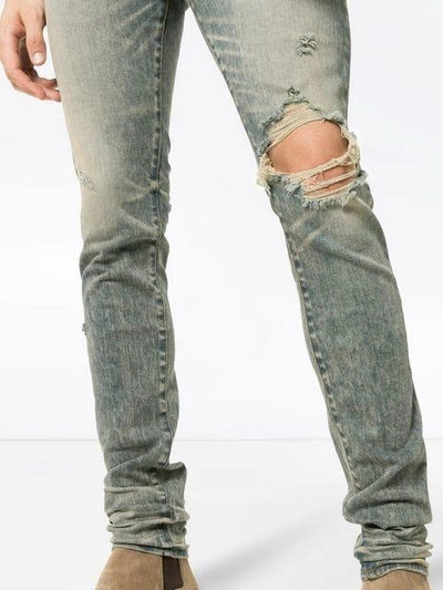 Shop Amiri Distressed Skinny Jeans In Blue