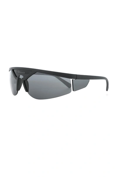 Shop Versace Wrap Shield Sunglasses In Matte Black