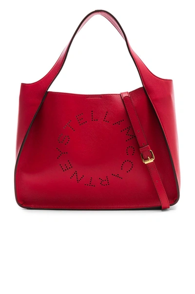 Shop Stella Mccartney Perforated Logo Crossbody Tote In Lover Red