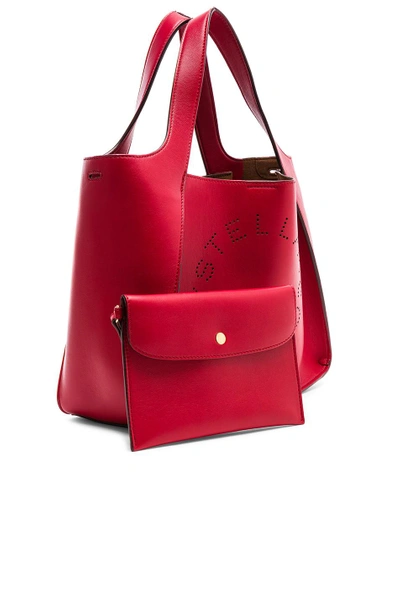 Shop Stella Mccartney Perforated Logo Crossbody Tote In Lover Red