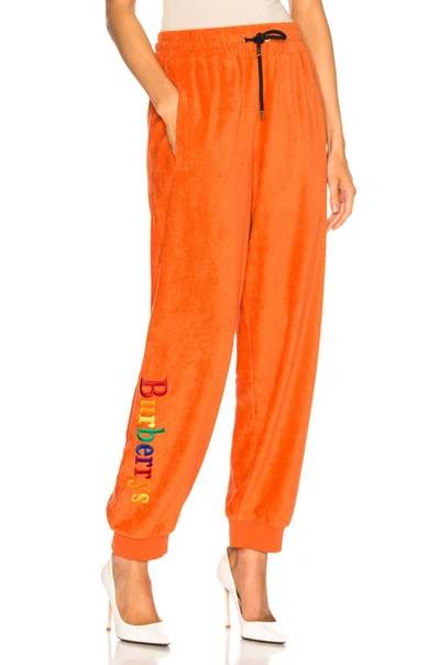 Shop Burberry Rainbow Logo Sweatpants In Orange