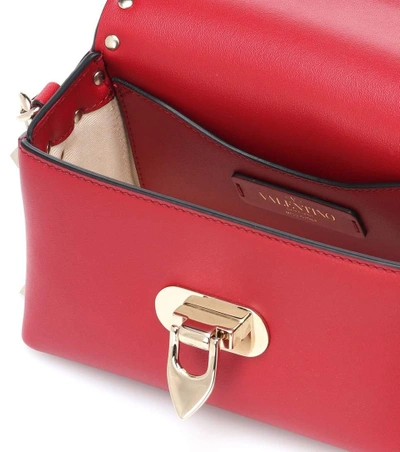 Shop Valentino Rockstud Leather Shoulder Bag In Red