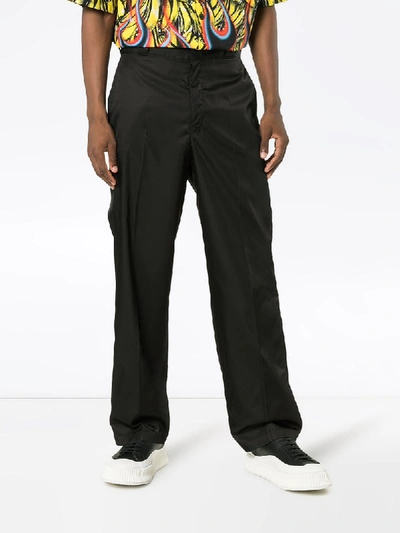 Shop Prada Nylon Logo Badge Trousers - Black