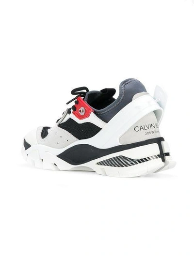 Shop Calvin Klein 205w39nyc Sporty Sneakers In White