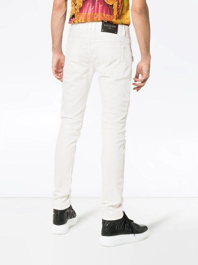 Shop Balmain Skinny Logo Patch Biker Jeans In White