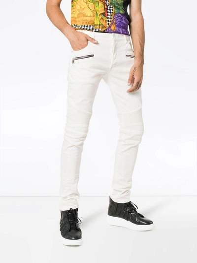 Shop Balmain Skinny Logo Patch Biker Jeans In White