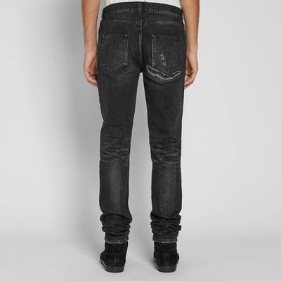 Shop Saint Laurent Distressed Skinny Jean In Black