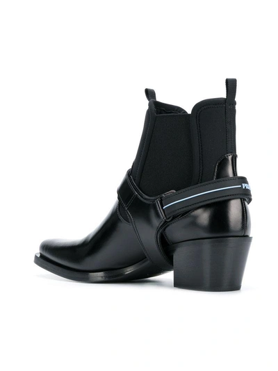 Shop Prada Strap Buckle Boots In Black