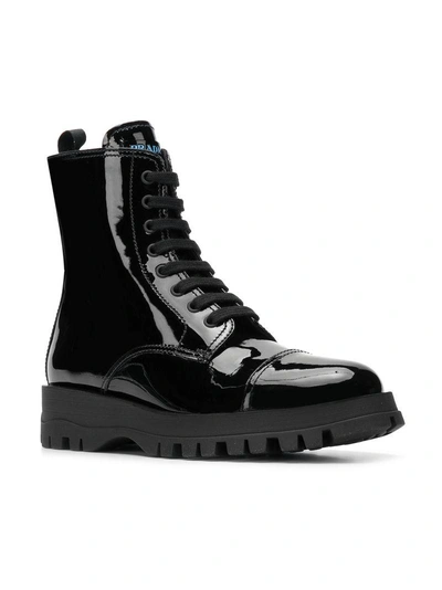 Shop Prada Varnish Lace Up Boots In Black