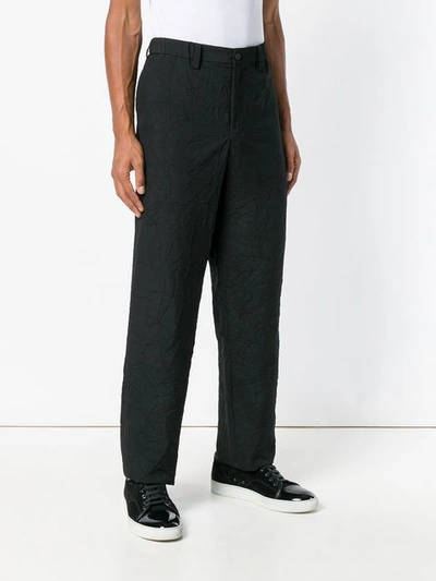 wrinkled effect trousers