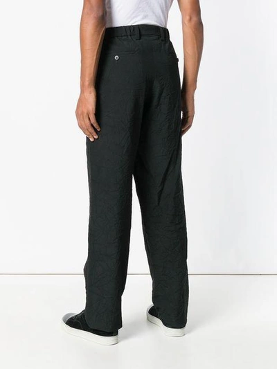 Shop Issey Miyake Men Wrinkled Effect Trousers - Black
