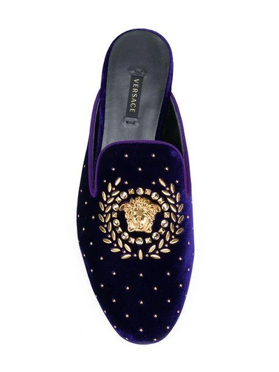 Shop Versace Embellished Medusa Mules - Blue