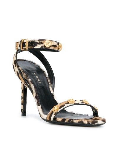 Shop Versace Leopard Print Sandals - Brown