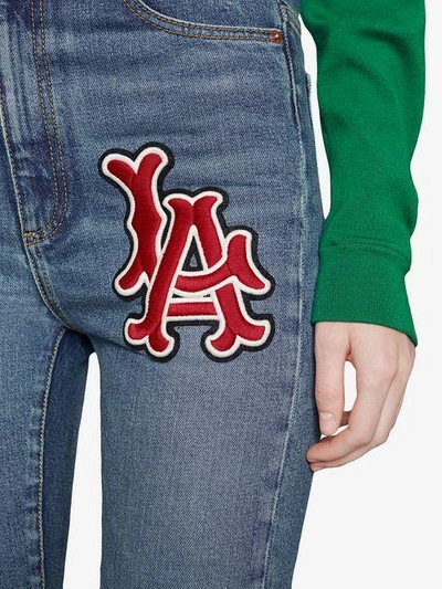 Shop Gucci Skinny Denim Trousers With La Angels™ Patch In Blue