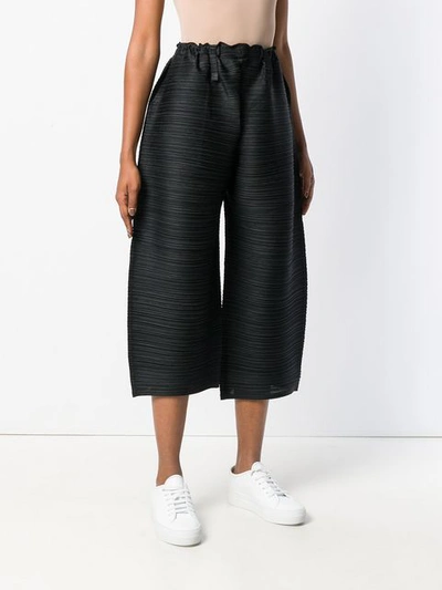 Shop Issey Miyake Pleats Please By  Pleated Wide Leg Cropped Trousers - Black