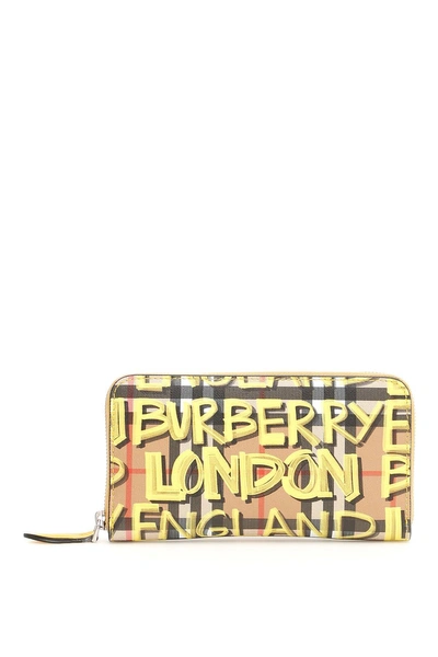 Shop Burberry Graffiti Zip-around Wallet In Yellow