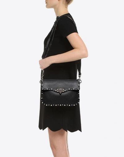 Shop Valentino Guitar Strap Crossbody Bag In Black