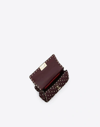 Shop Valentino Garavani Small Rockstud Spike Nappa Leather Bag In Ruby