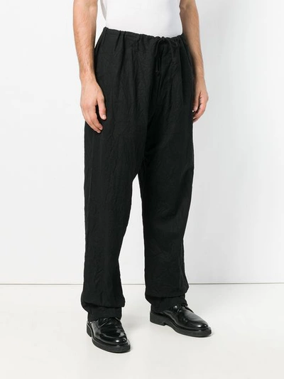 Shop Yohji Yamamoto "wrinkled" Relaxed Trousers - Black