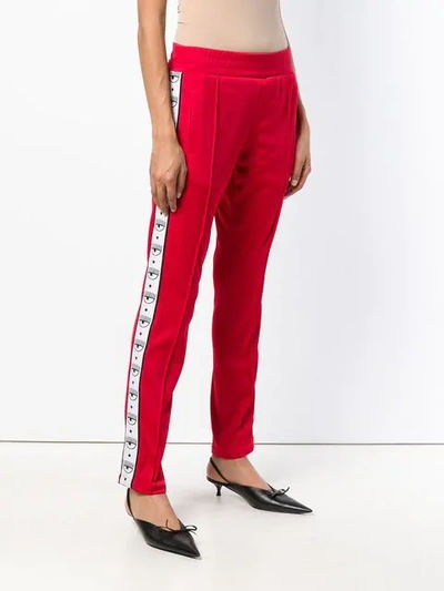 Shop Chiara Ferragni Eye-motif Straight Track Trousers In Red