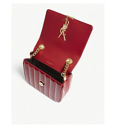 Shop Saint Laurent Monogram Vicky Small Patent Leather Cross-body Bag In Red