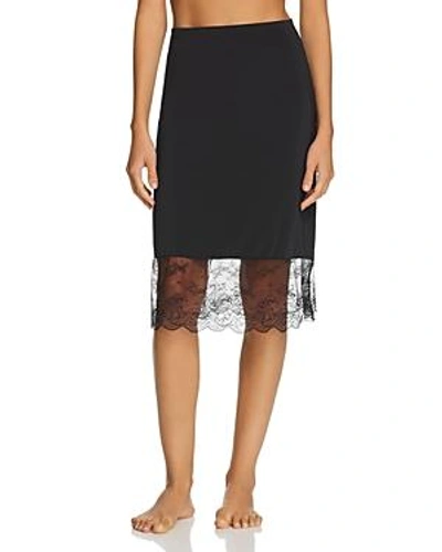 Shop Natori Infinity Lace-trim Slip Skirt In Black