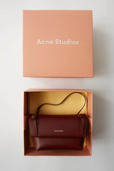 Shop Acne Studios Mini Bag Burgundy