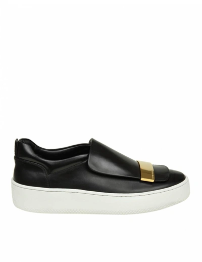 Shop Sergio Rossi Slip-on In Black Leather With Metal Plate In Gold Contras