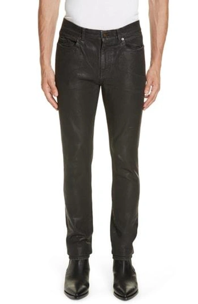 Shop Saint Laurent Wax Coated Skinny Jeans In 1408 Black